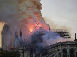 The spire collapses while flames are burning the roof of the Notre-Dame Cathedral in Paris, France. Ian Langsdon/EPA